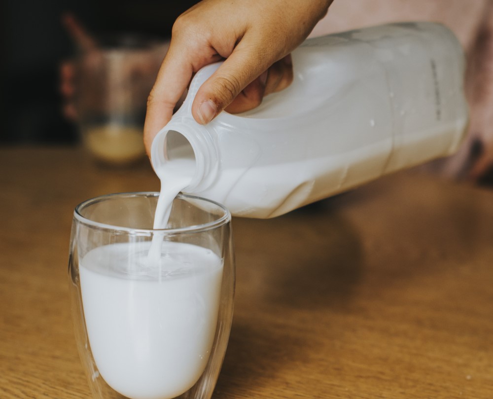 pouring a glass of milk